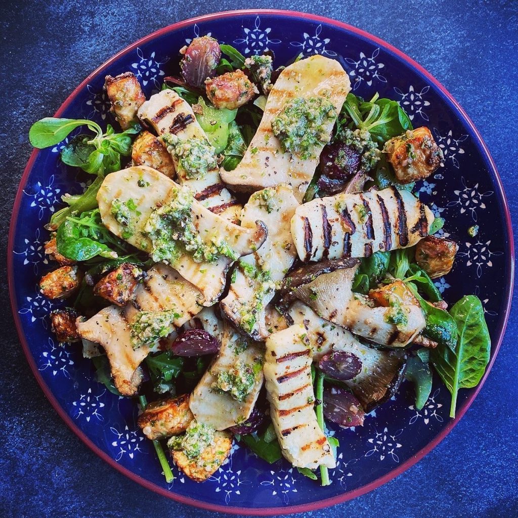 Roast celeriac and king oyster mushroom salad with halloumi and walnut pesto